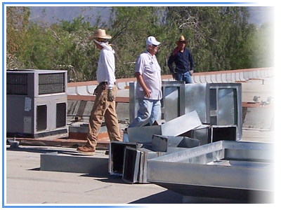 Technicians working on Inductrial/Commercial HVAC on a Rooftop